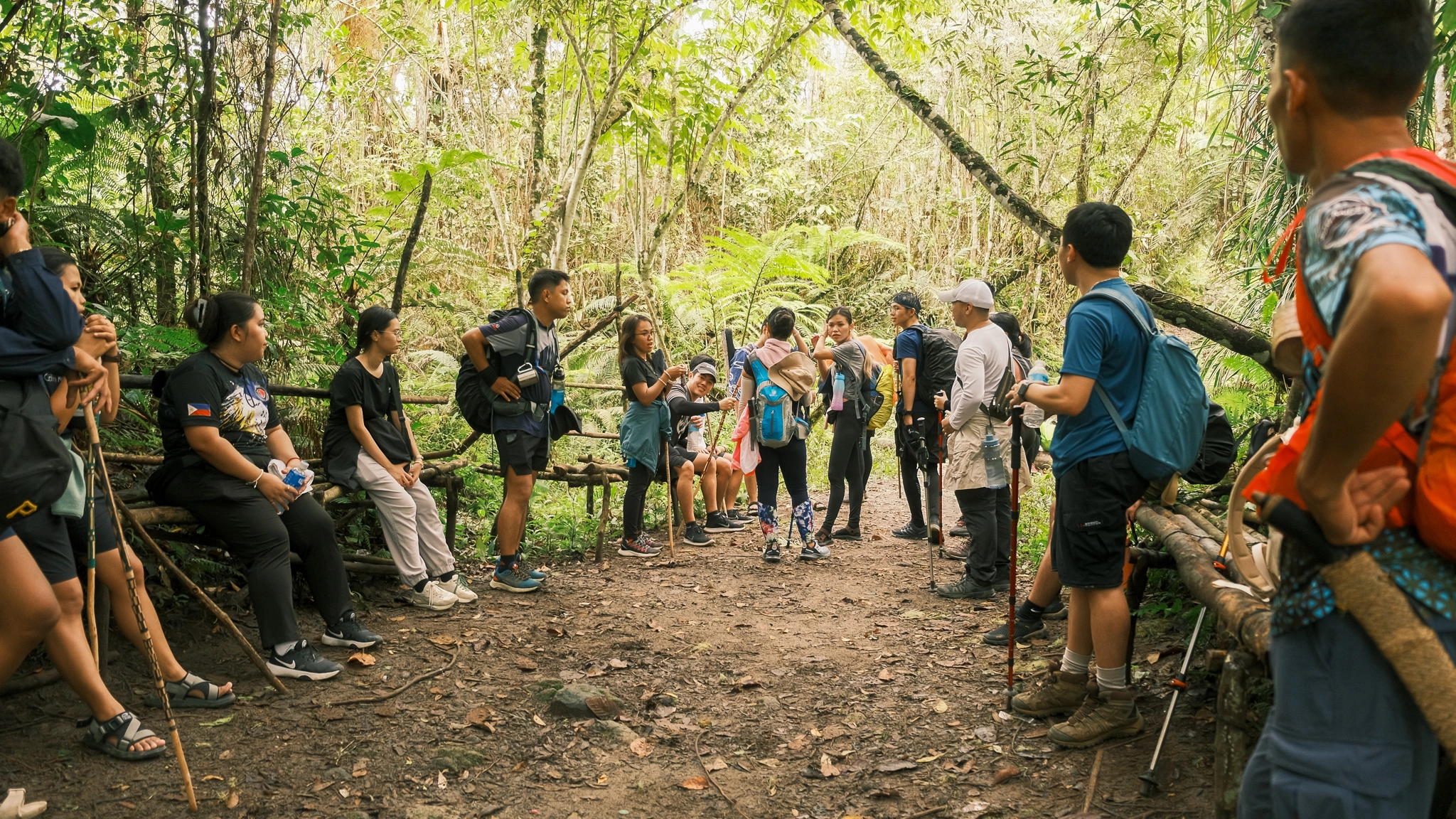 A group of people taking a pause at Salacafe trail at Lake Holon